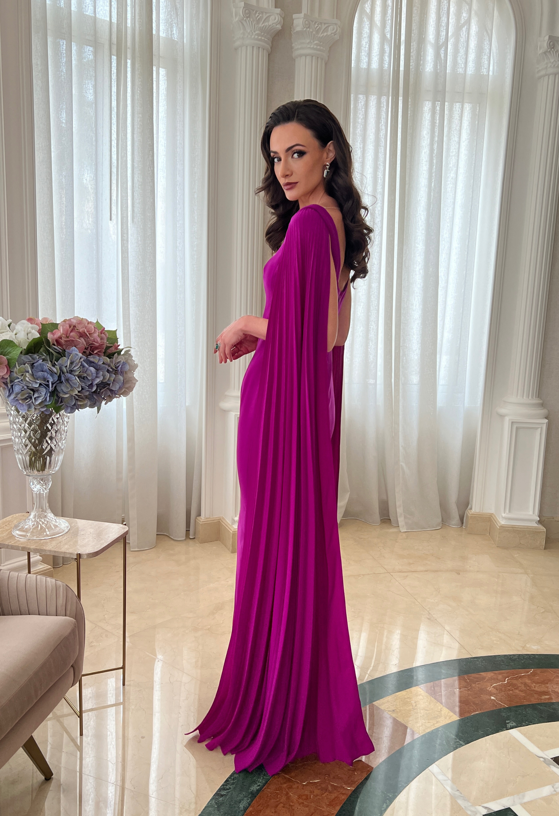Gown with pleated cape sleeves